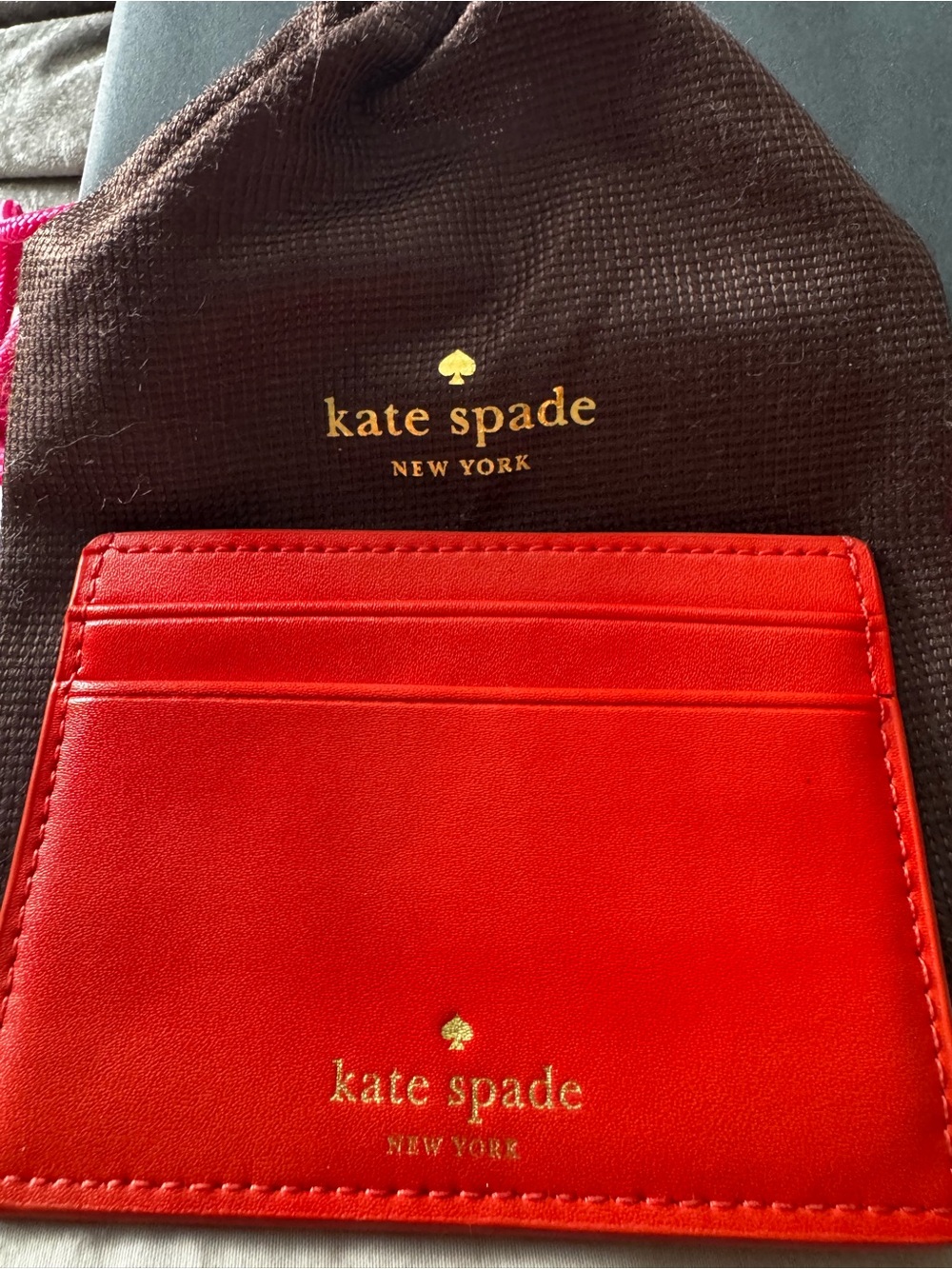 kate spade red card holder with gold foil "adventure fund"